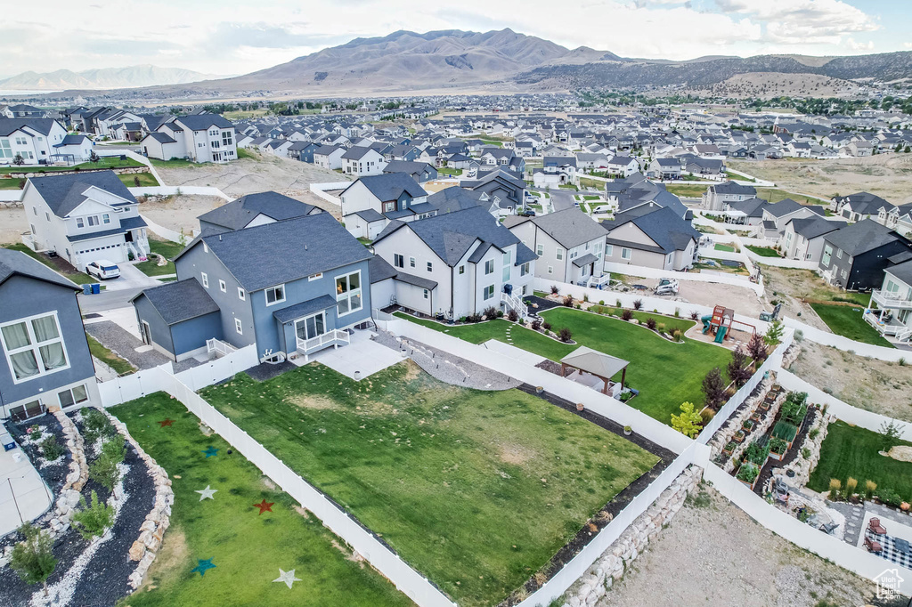 Aerial perspective of suburban area featuring a mountain backdrop