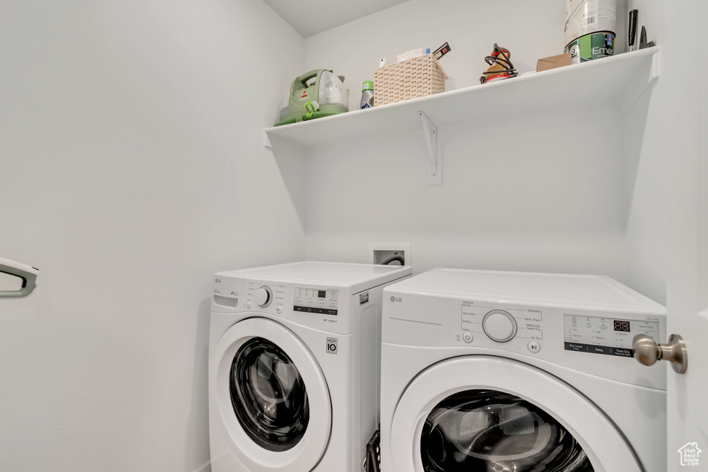 Laundry room featuring separate washer and dryer