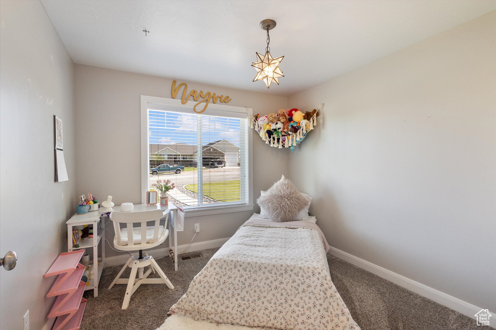 Carpeted bedroom with baseboards