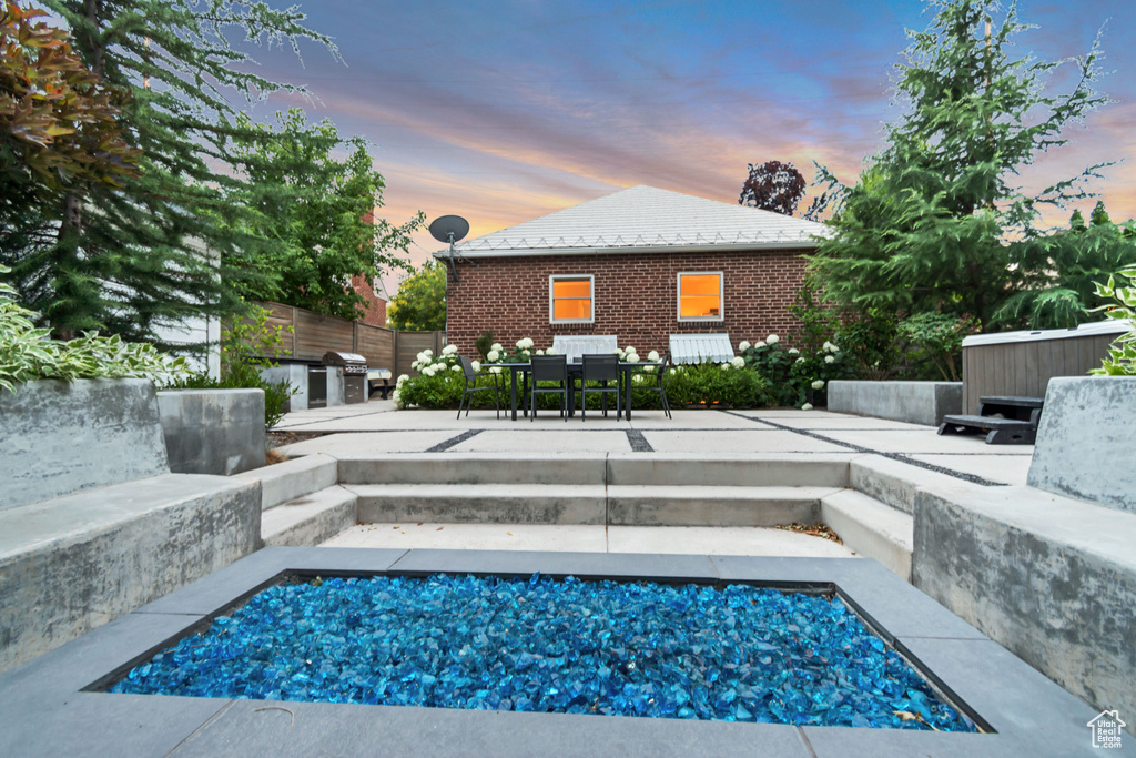 View of swimming pool with a patio and outdoor dining area