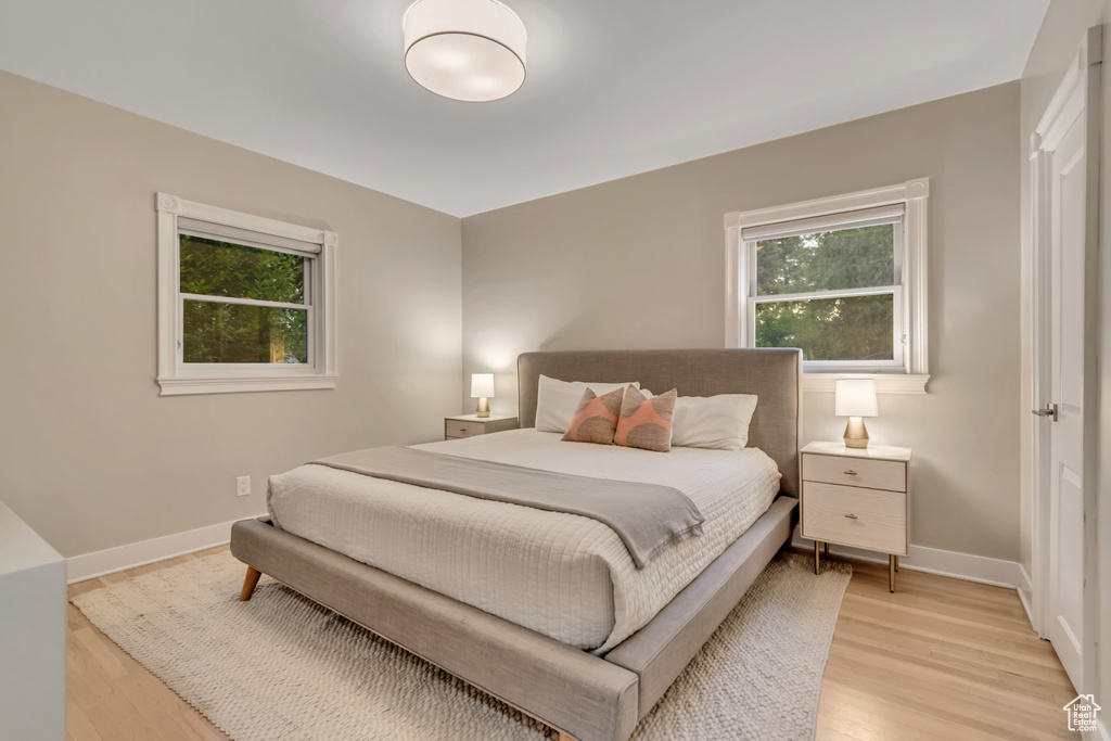 Bedroom featuring light wood-type flooring and baseboards