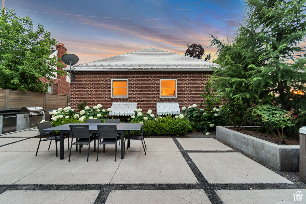 View of patio featuring outdoor dining space and area for grilling