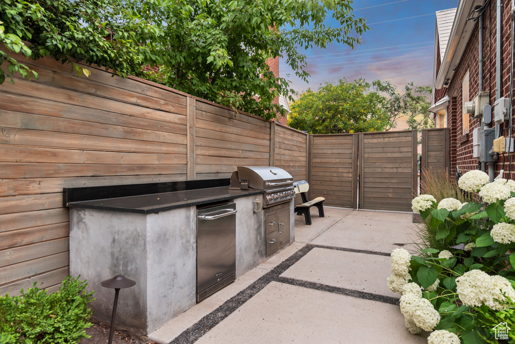 View of patio featuring an outdoor kitchen