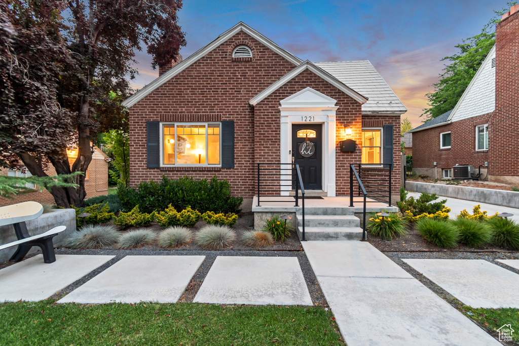 Bungalow-style house featuring brick siding