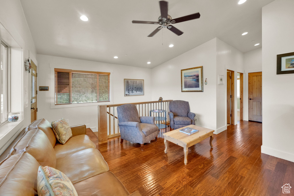 Living room featuring ceiling fan, lofted ceiling, recessed lighting, and wood finished floors