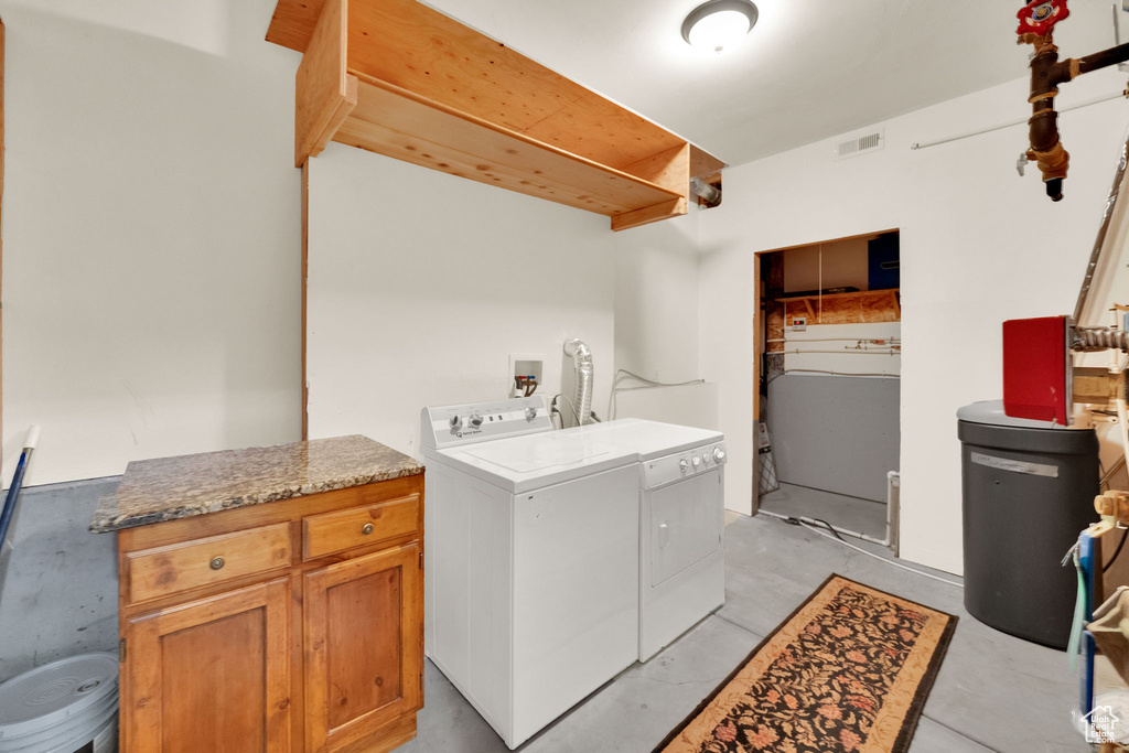 Laundry room with washing machine and dryer and cabinet space