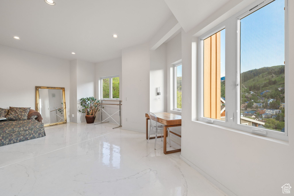 Corridor with recessed lighting and marble tiled floors