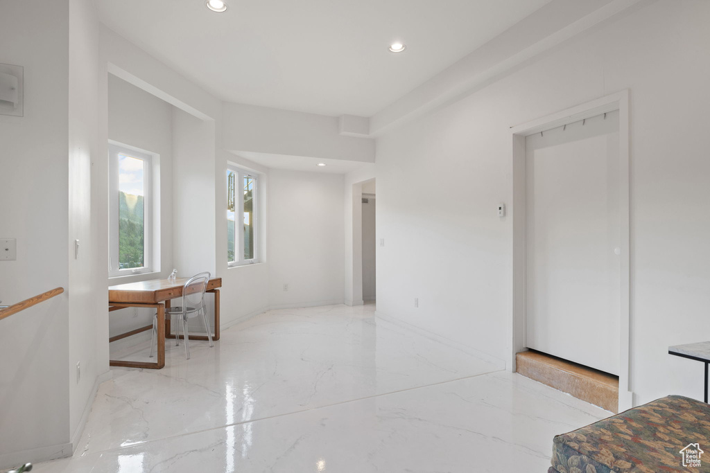 Spare room featuring recessed lighting and light marble finish floors