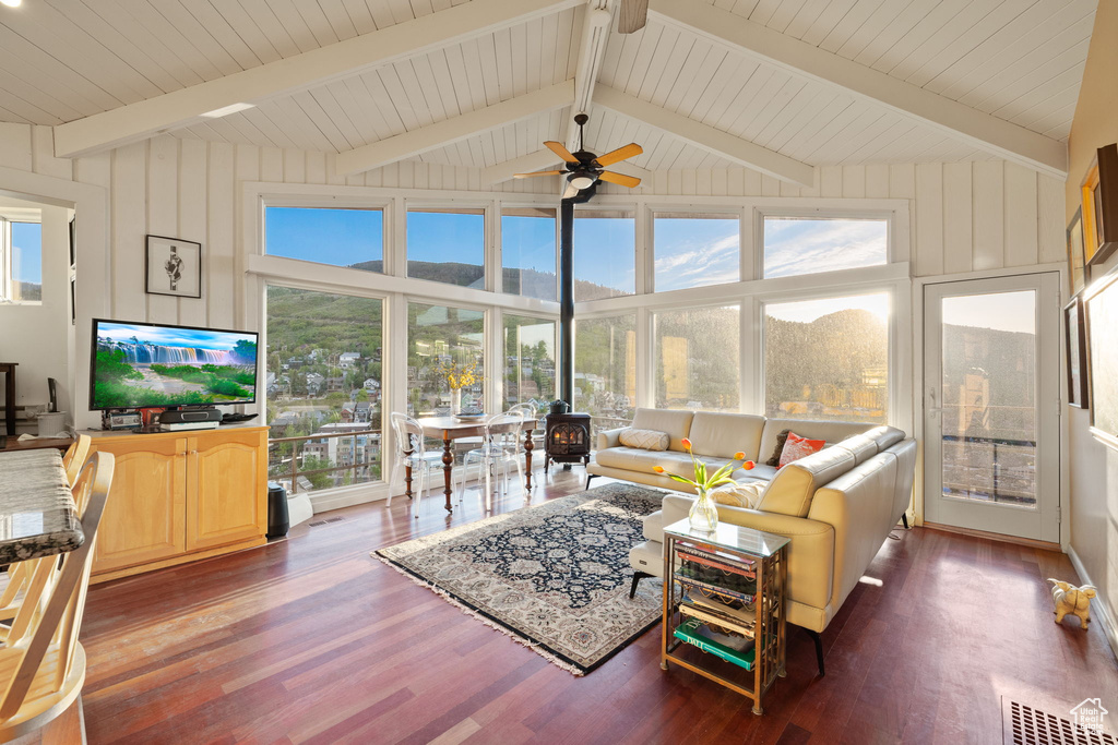 Living area featuring wood finished floors, healthy amount of natural light, and ceiling fan