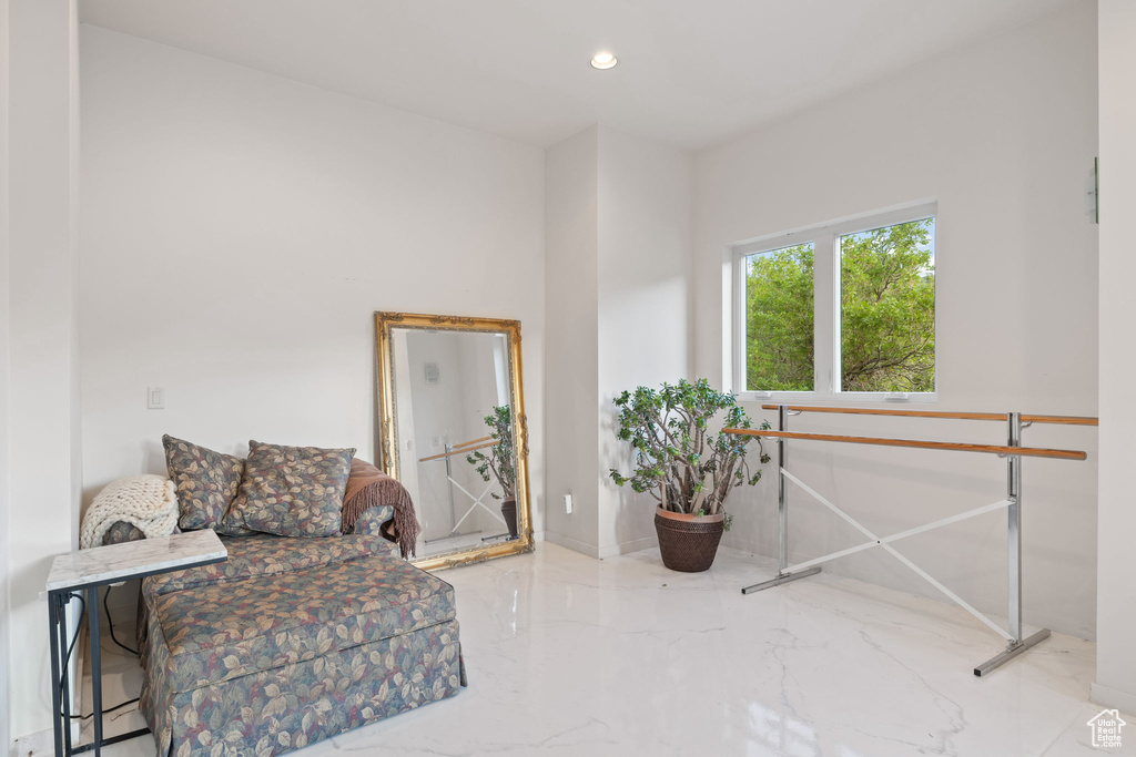 Sitting room featuring marble tiled floors and recessed lighting