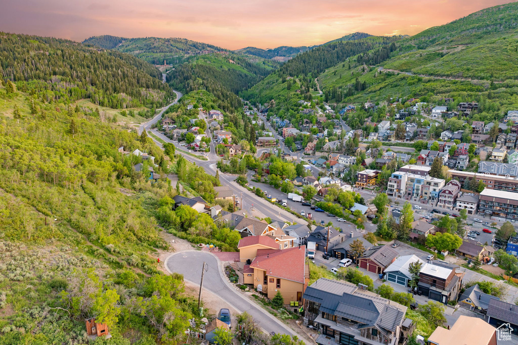 Aerial view at dusk of a mountain view and a view of trees