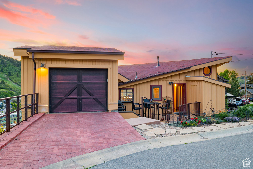 View of front of home with a shingled roof