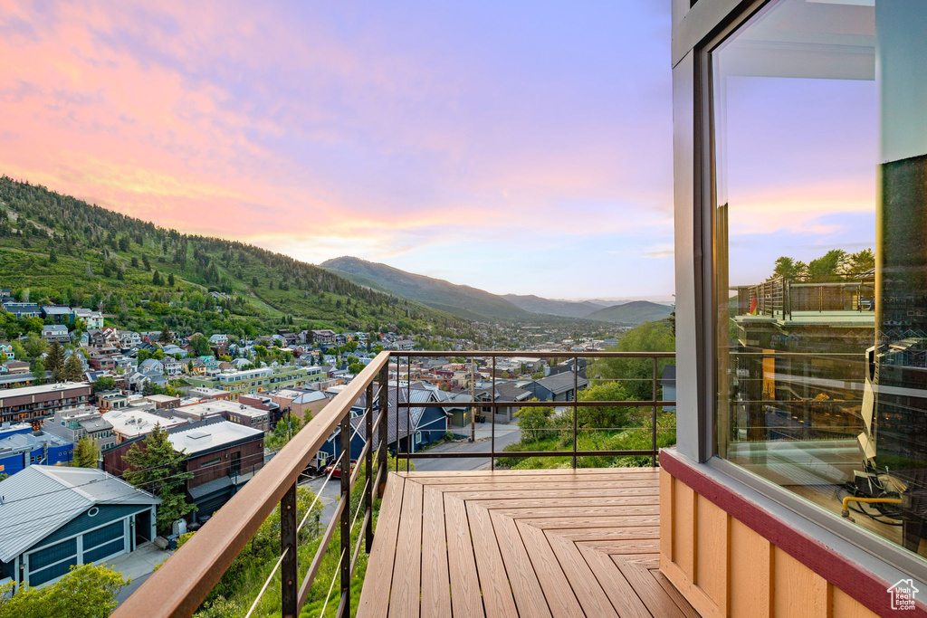 Balcony at dusk with a mountain view
