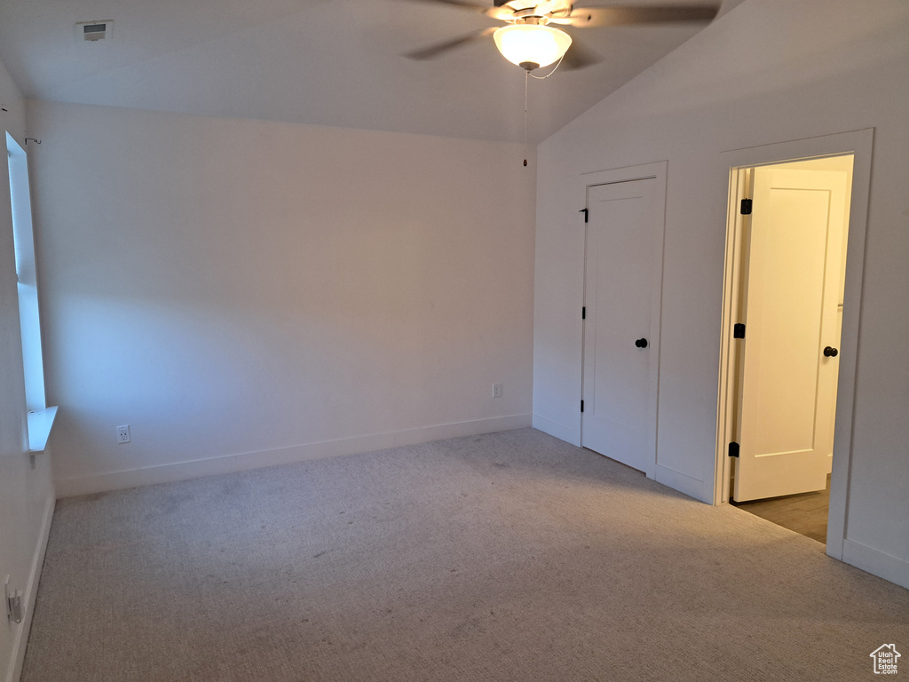 Unfurnished bedroom with carpet floors and ceiling fan