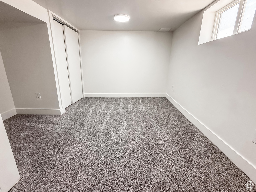 Below grade area with carpet and baseboards