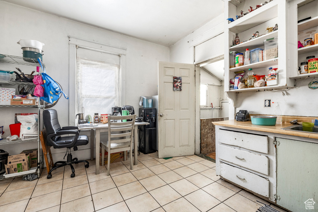 Office with light tile patterned floors