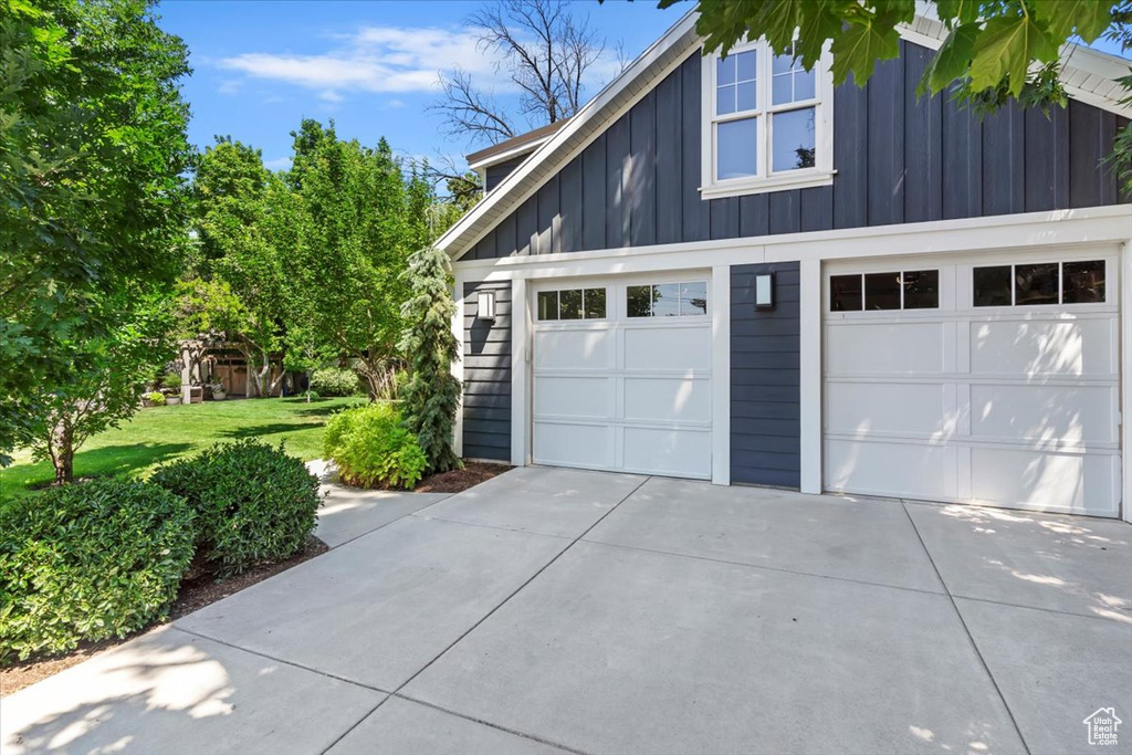 Garage featuring driveway