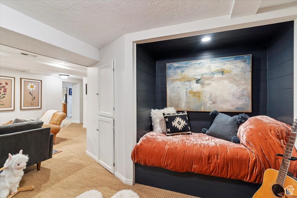 Carpeted living room with baseboards