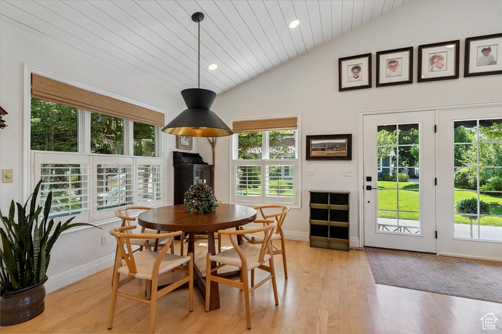 Dining room featuring vaulted ceiling, light wood finished floors, plenty of natural light, wooden ceiling, and recessed lighting