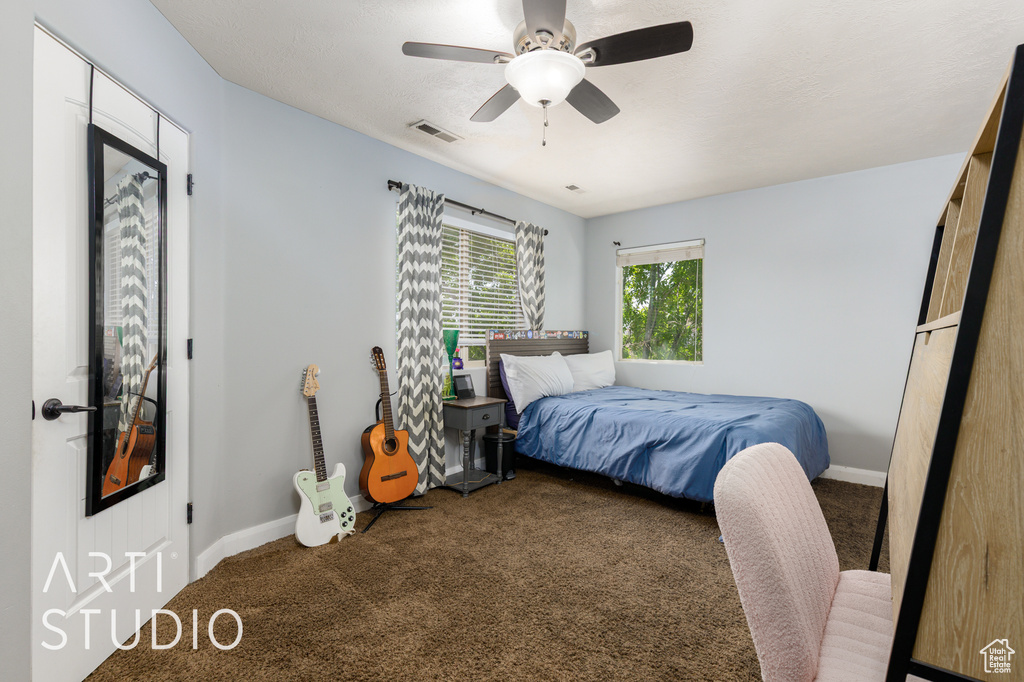 Bedroom featuring carpet and a ceiling fan