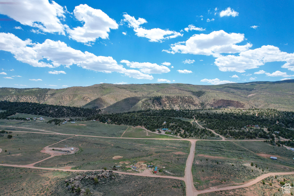 View of mountain backdrop with rural landscape