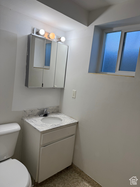 Bathroom with toilet and vanity