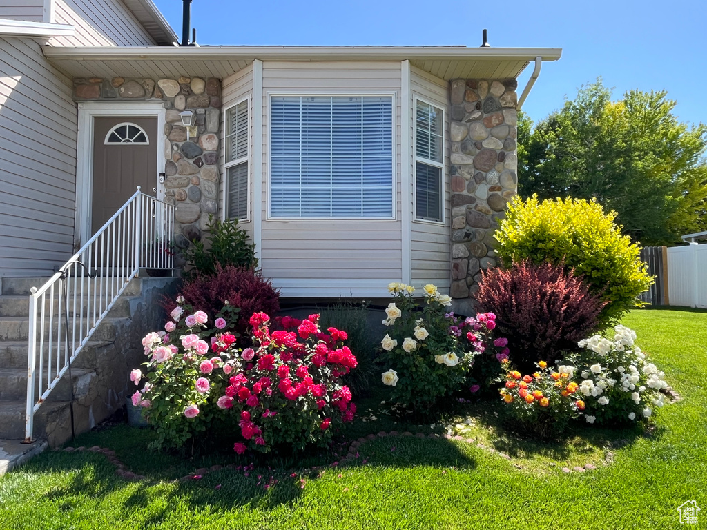 Entrance to property with stone siding