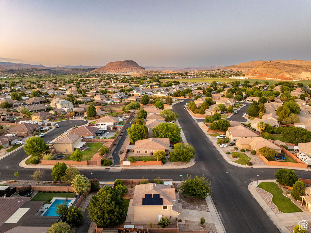Aerial perspective of suburban area featuring a mountain backdrop