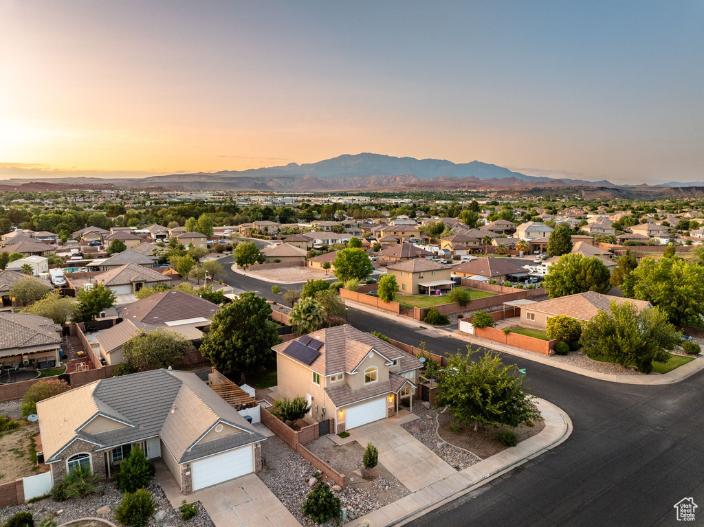 Aerial view at dusk of a residential view and a mountain view