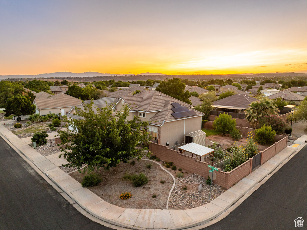 Aerial view at dusk of a residential view and a mountain view
