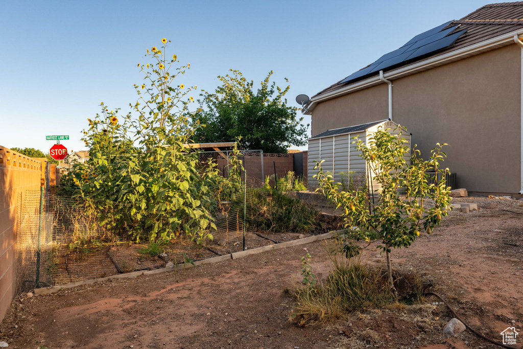Fenced backyard with a garden
