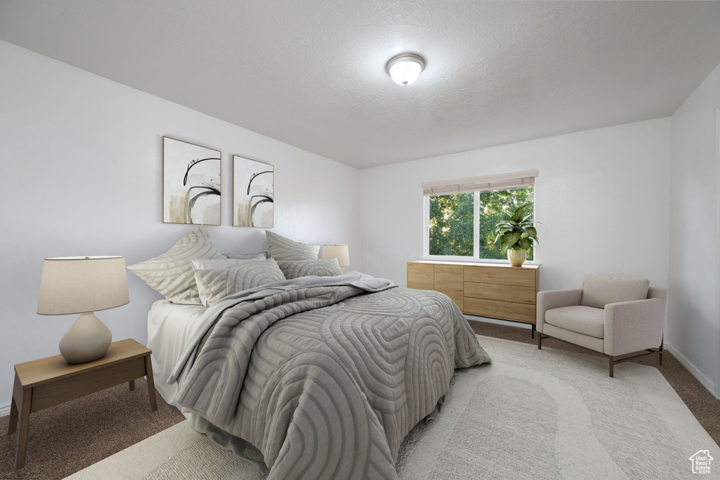 Bedroom with carpet floors and baseboards