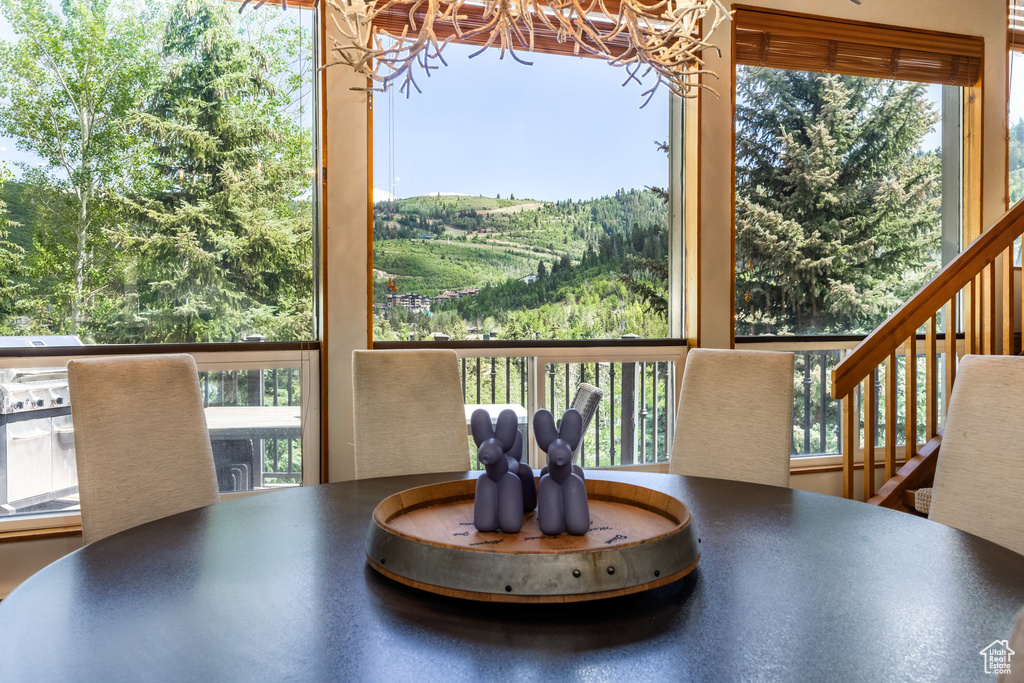 Dining area with a chandelier and healthy amount of natural light