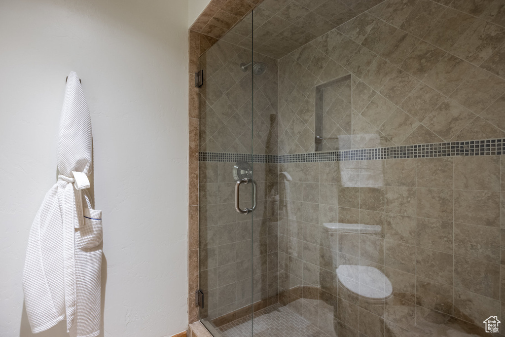 Bathroom featuring a shower stall