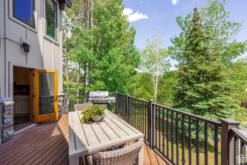 Deck with area for grilling and outdoor dining area