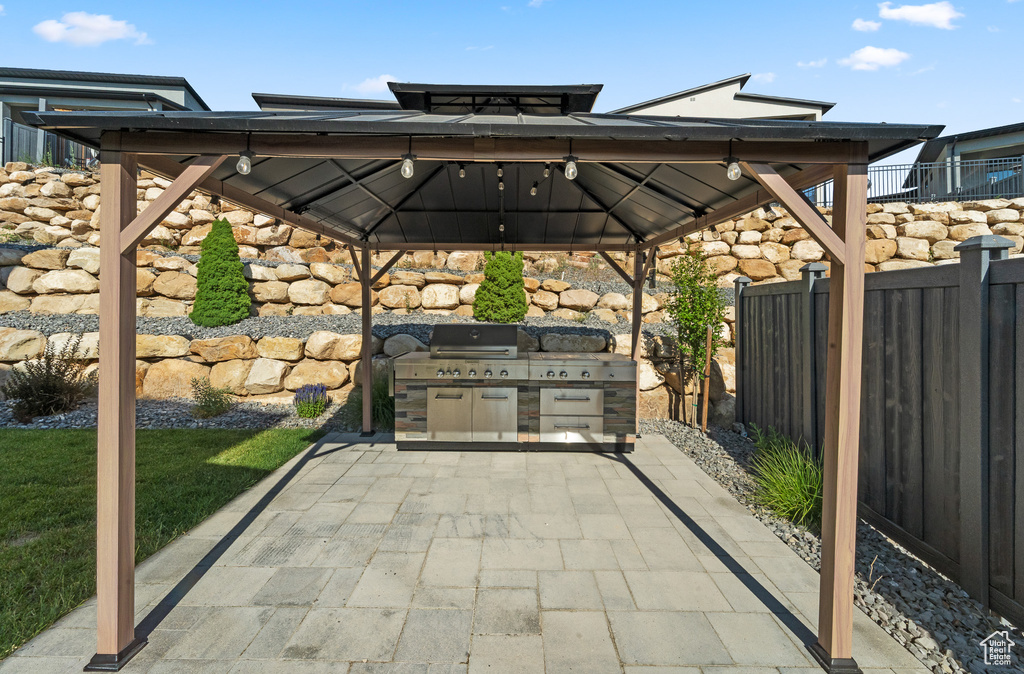 View of patio / terrace featuring a gazebo and exterior kitchen