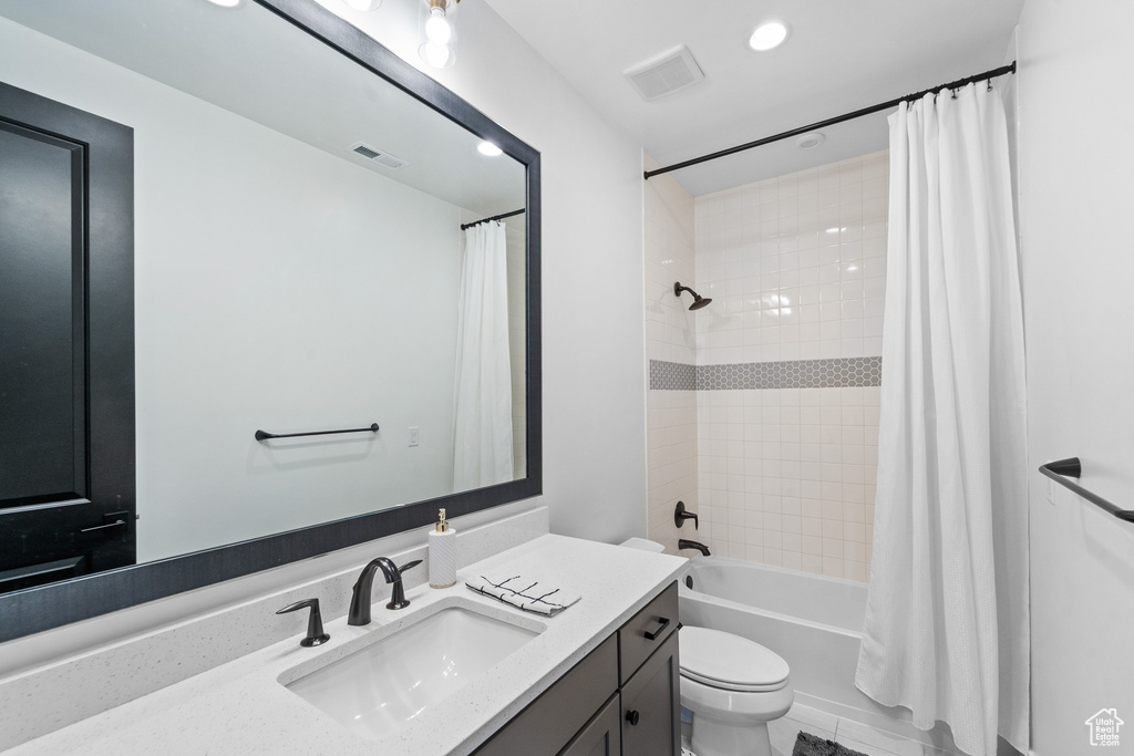 Full bath with vanity, shower / bath combination with curtain, and recessed lighting