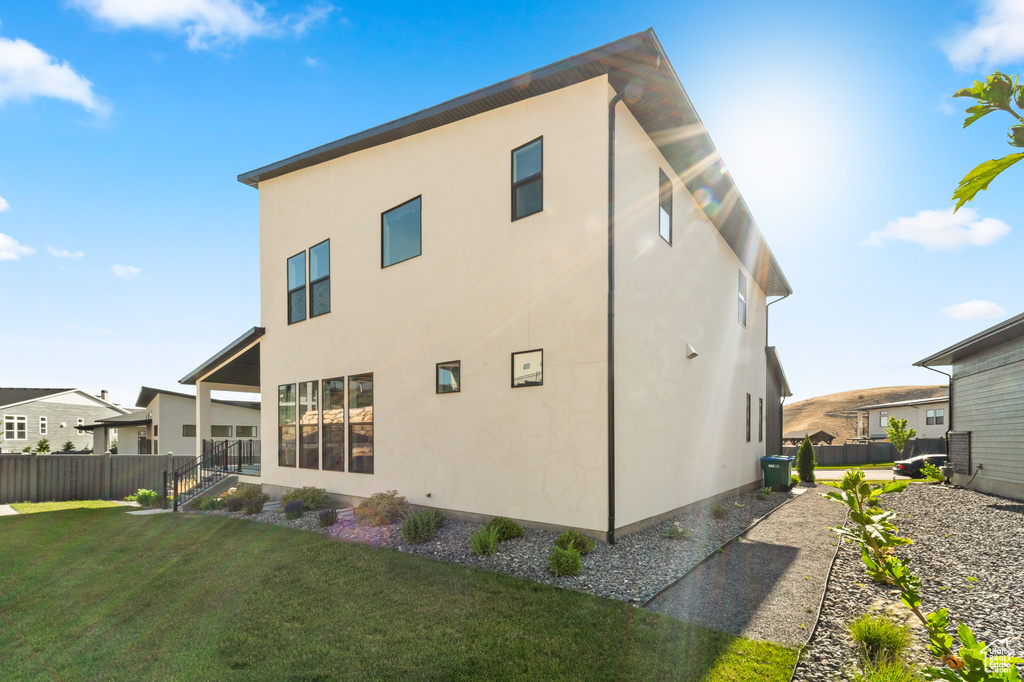 Rear view of property featuring stucco siding