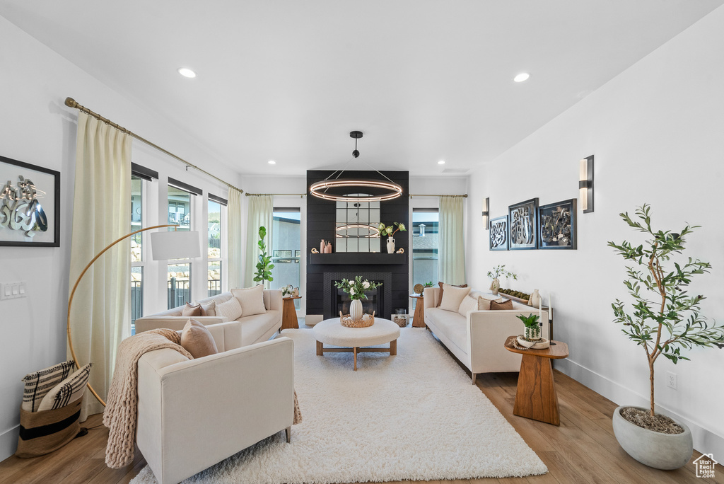 Living room featuring wood finished floors and recessed lighting
