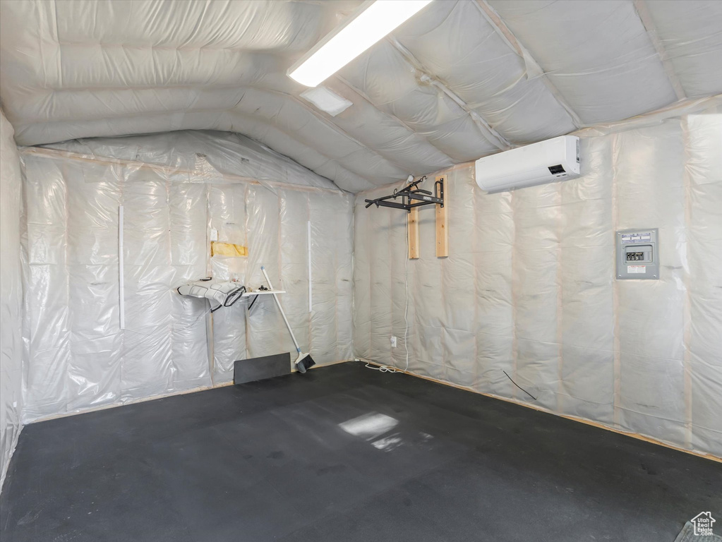 Basement featuring an AC wall unit