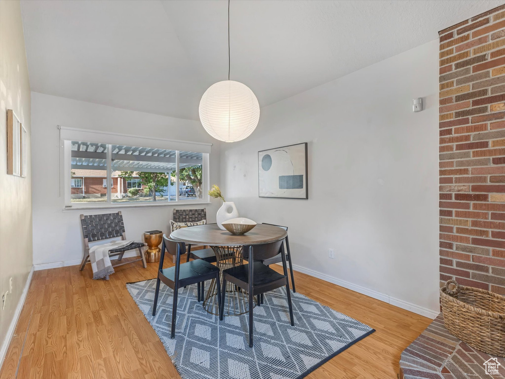Dining room featuring wood finished floors and baseboards