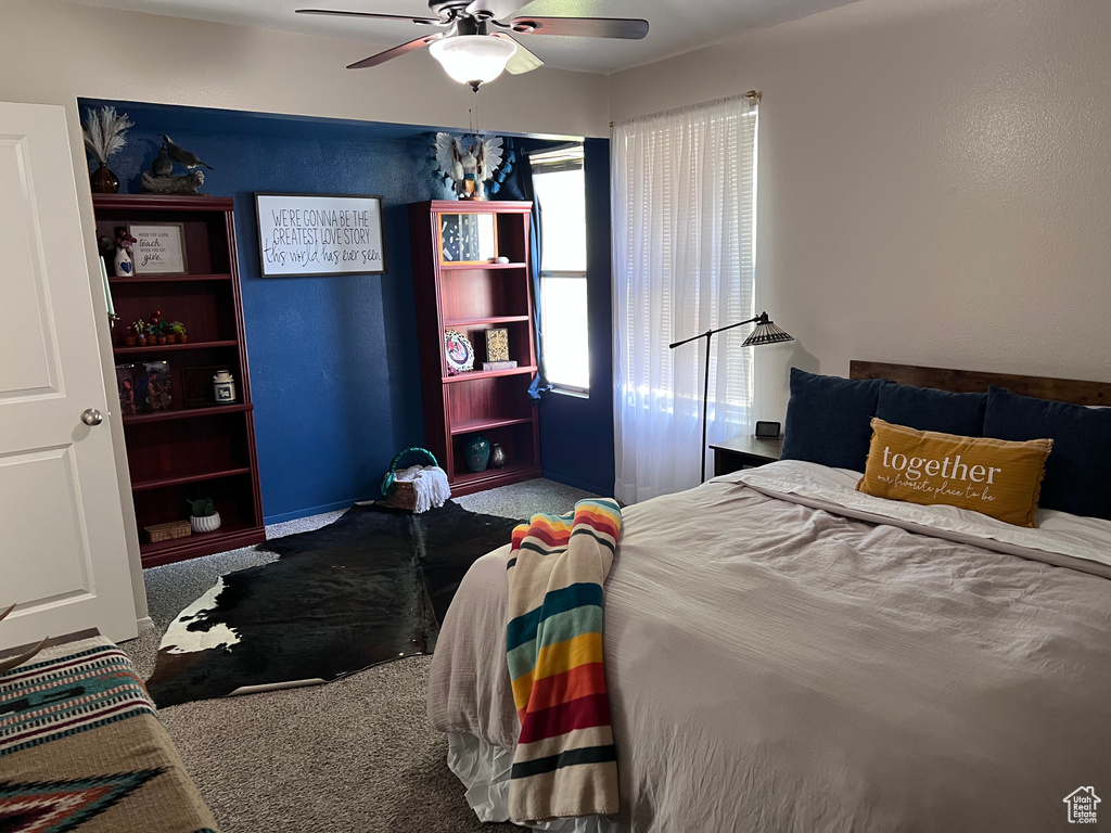 Bedroom with carpet and a ceiling fan