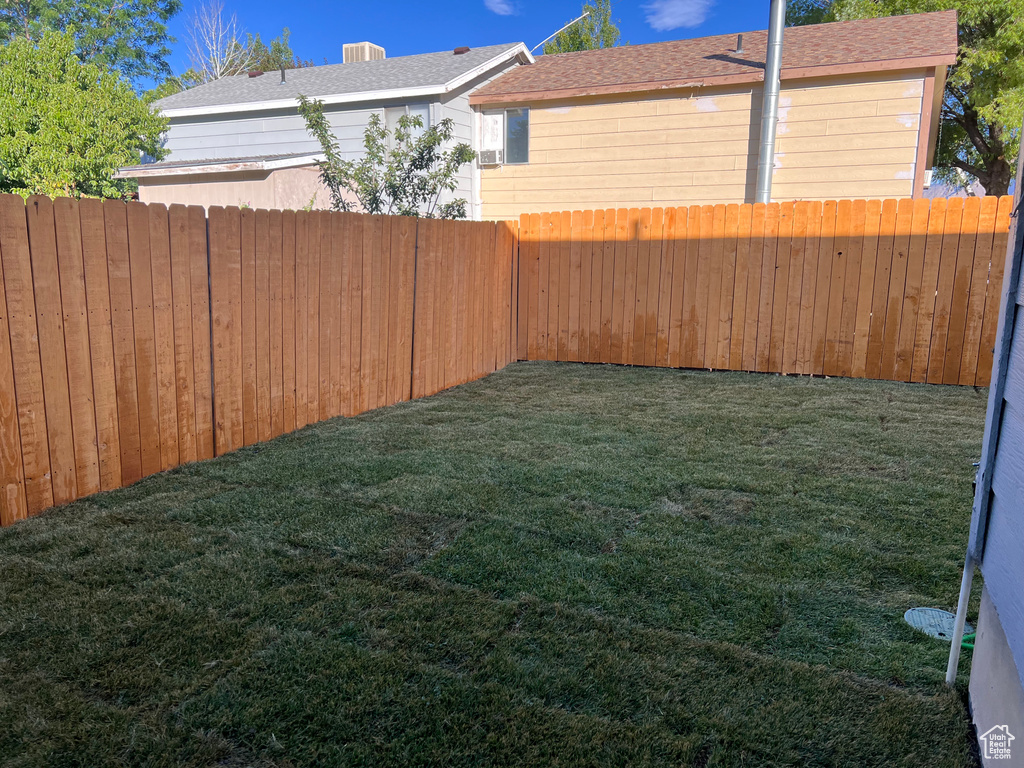 View of fenced backyard