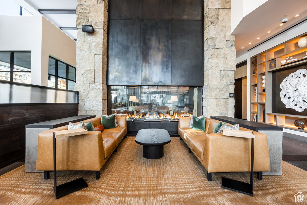 Lobby featuring a towering ceiling and a surveillance system