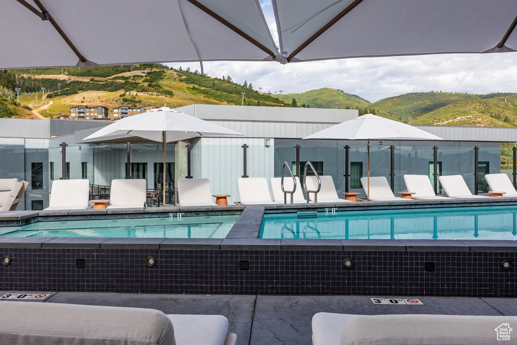 Community pool featuring a mountain view