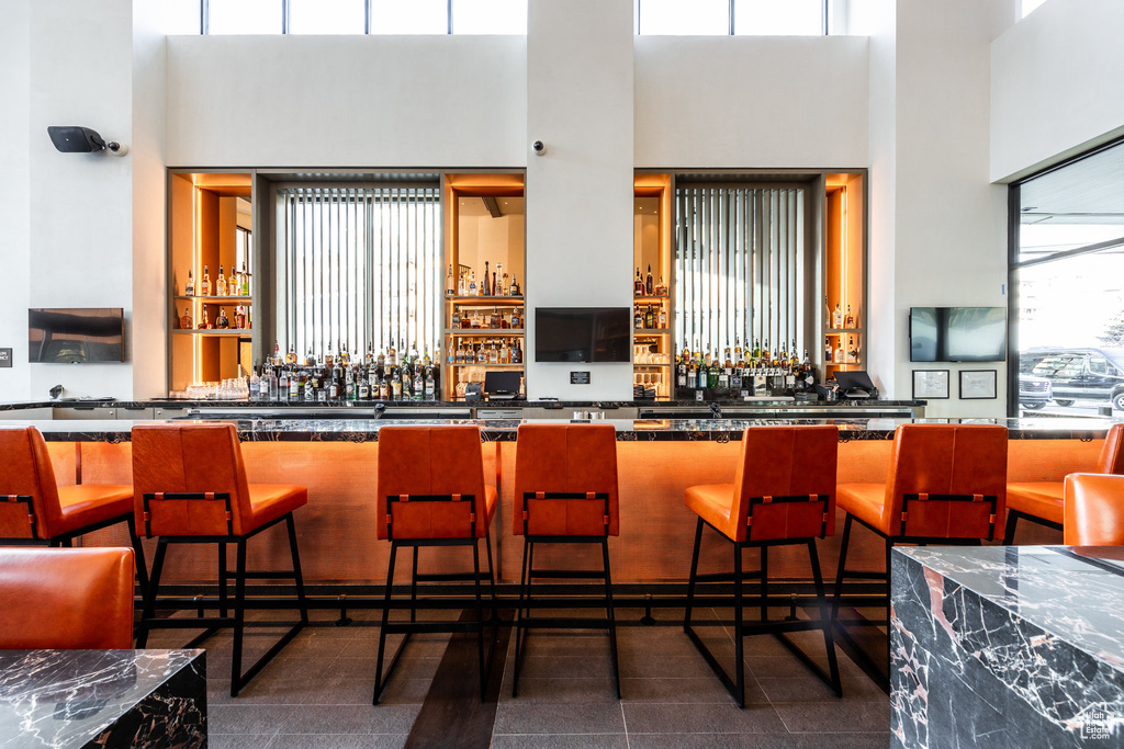 Community bar area with a towering ceiling