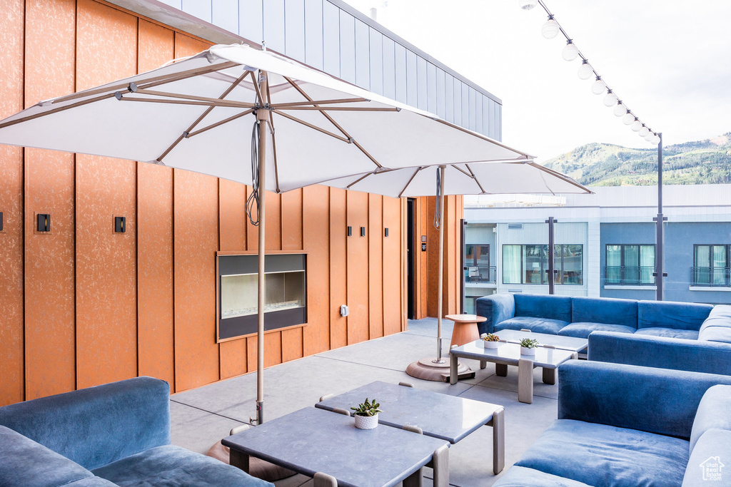 View of patio / terrace featuring an outdoor living space and a mountain view