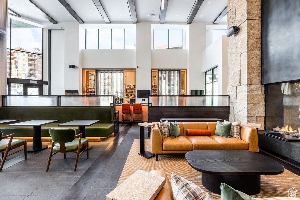 Lobby featuring beam ceiling and a high ceiling