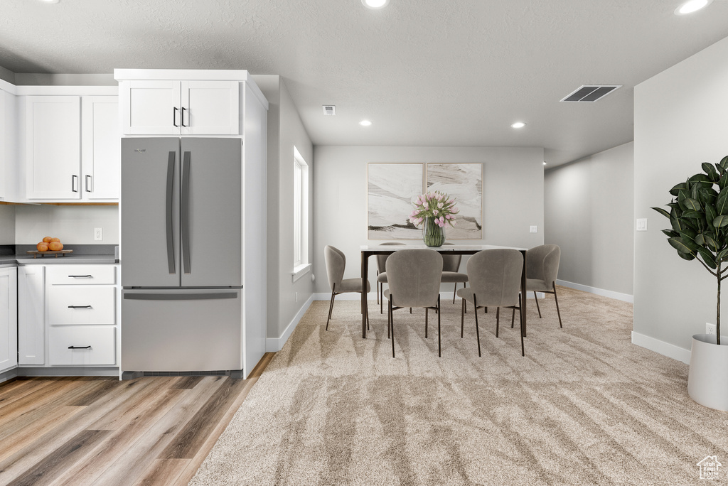 Dining area featuring recessed lighting and baseboards