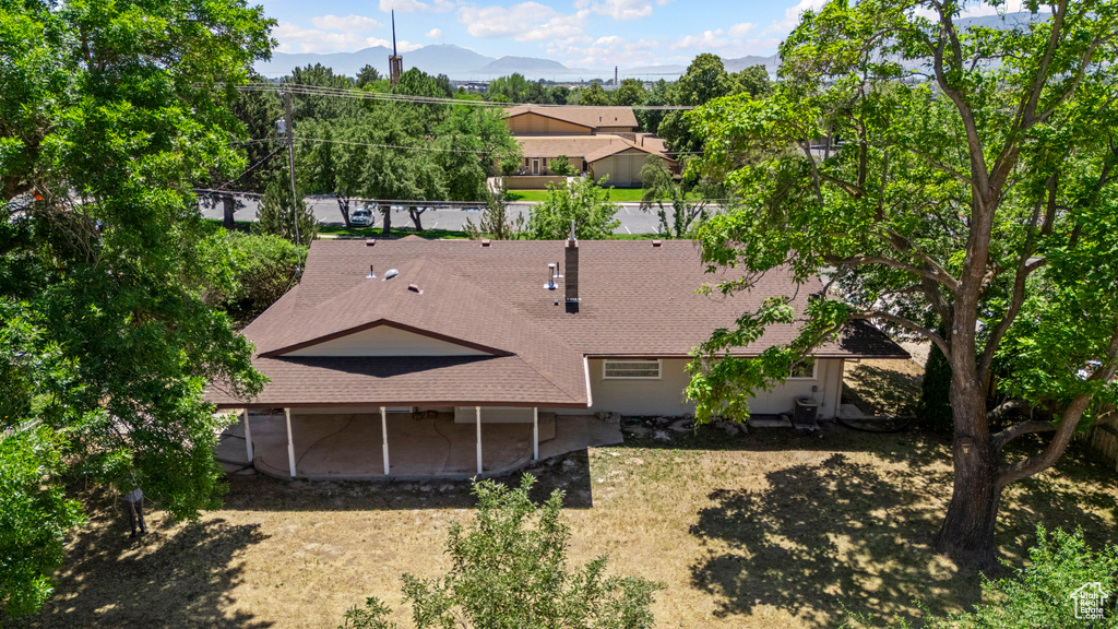 View of subject property featuring mountains